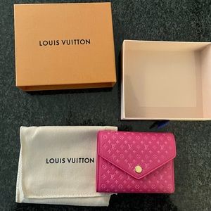 Authentic and brand new unused Louis Vuitton “Victorine” wallet